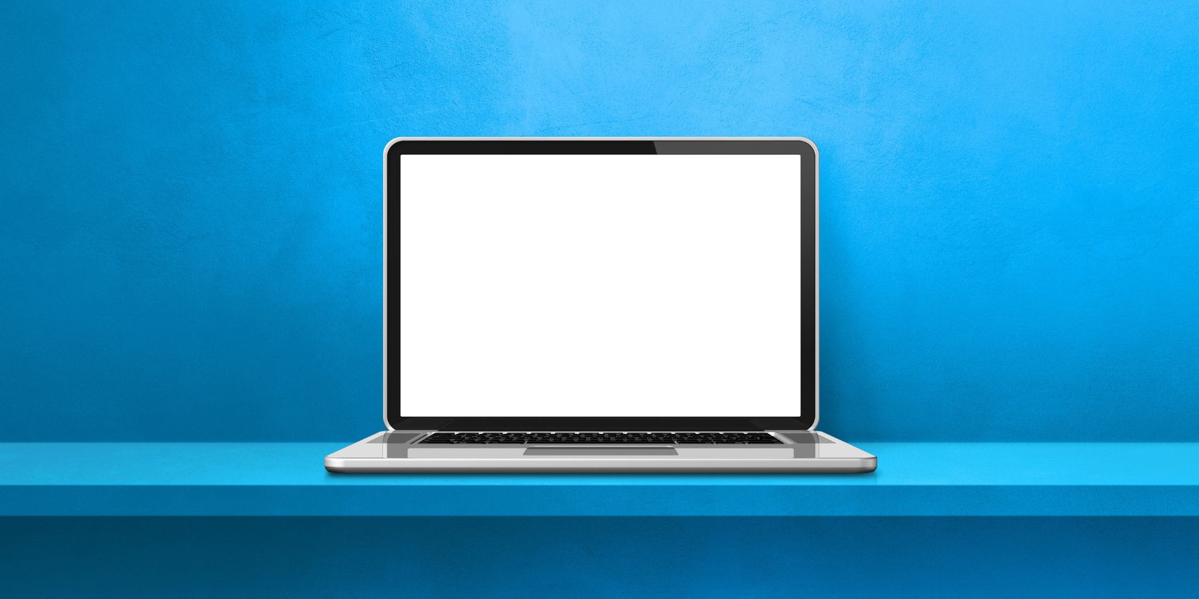 Ordinateur portable sur fond bleu